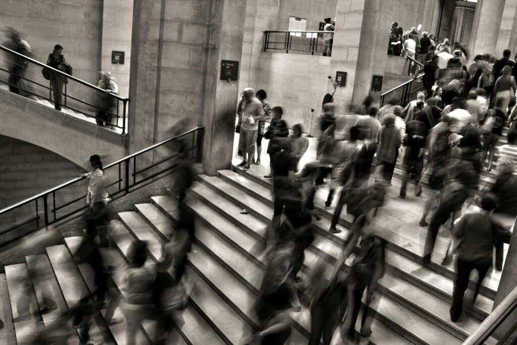 group of people walking up the stairs