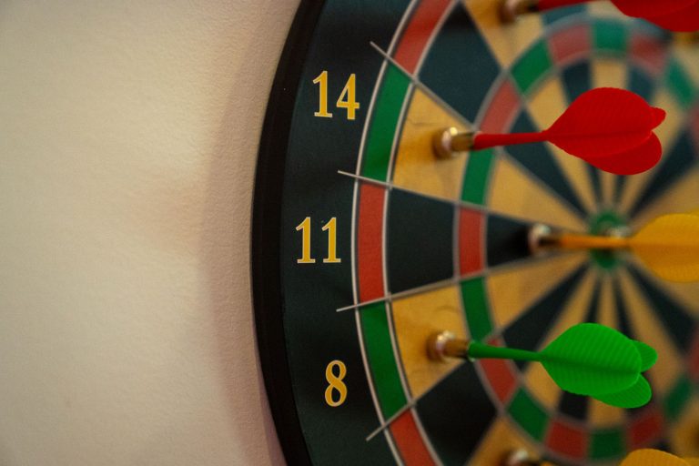 Darts in the bullseye of a dartboard