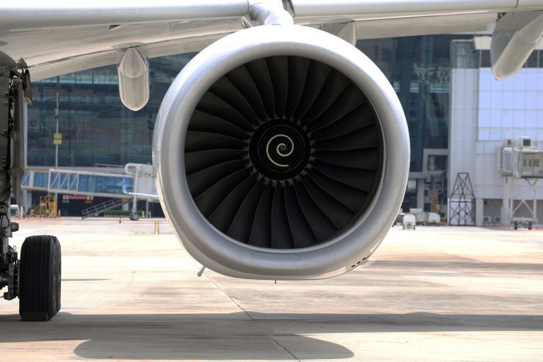 Close-up of a commercial jet engine on the tarmac