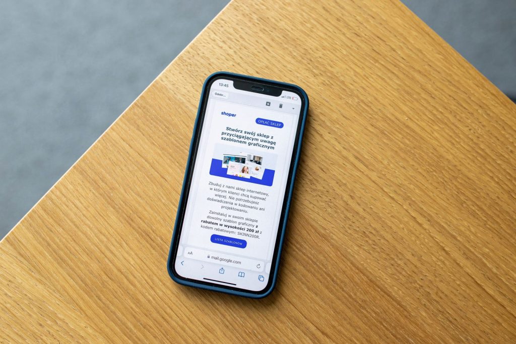 Smartphone on a desk displaying a marketing email