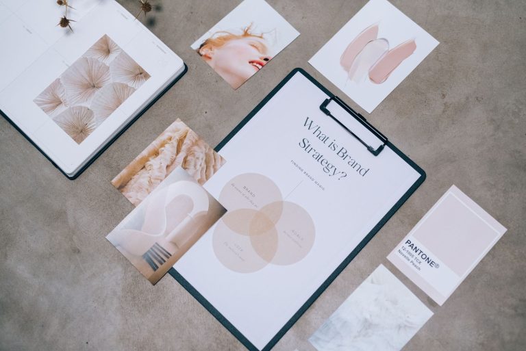 Brand identity concepts and print materials laid out on a table
