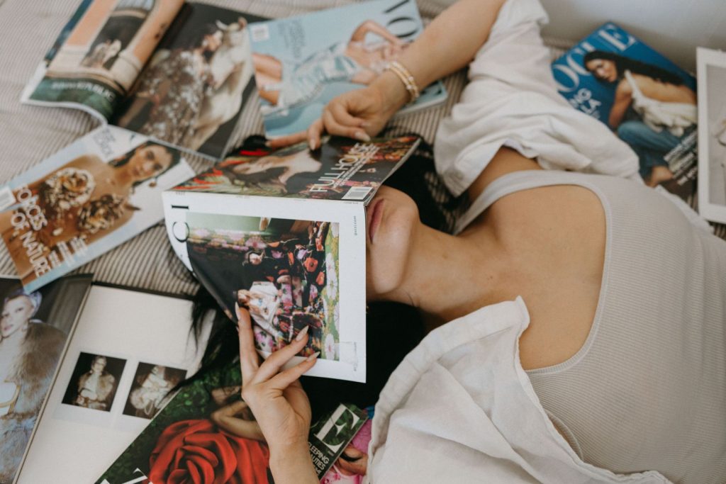 Reader flipping through a printed trade magazine