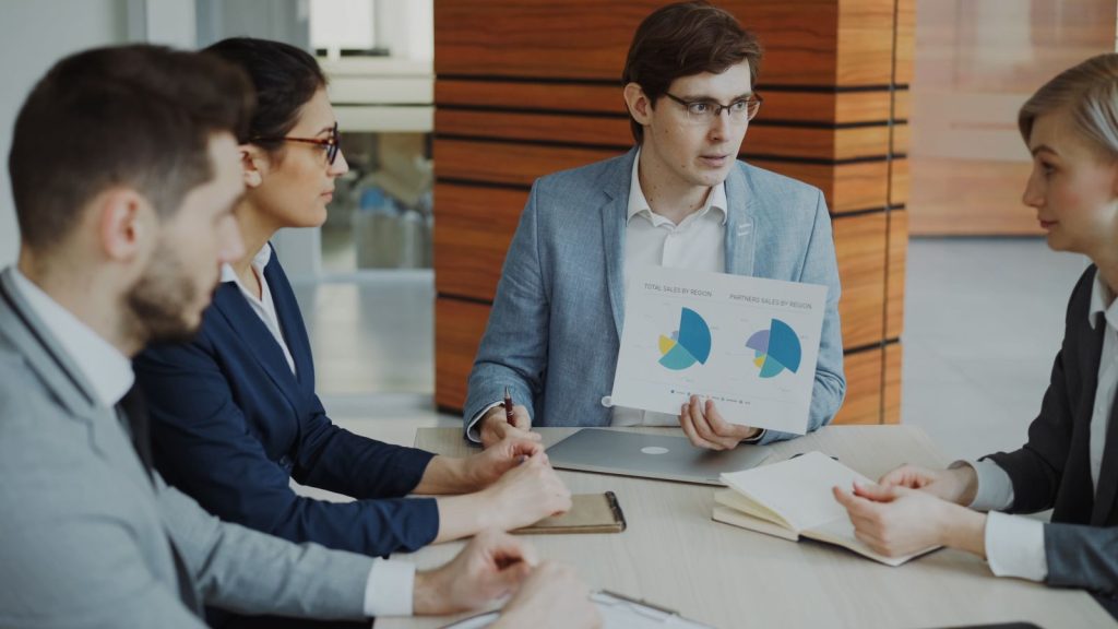 Leadership team reviewing a report together at a conference table