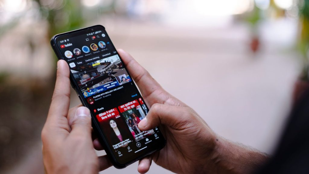 Person browsing on a smartphone where retargeting ads appear
