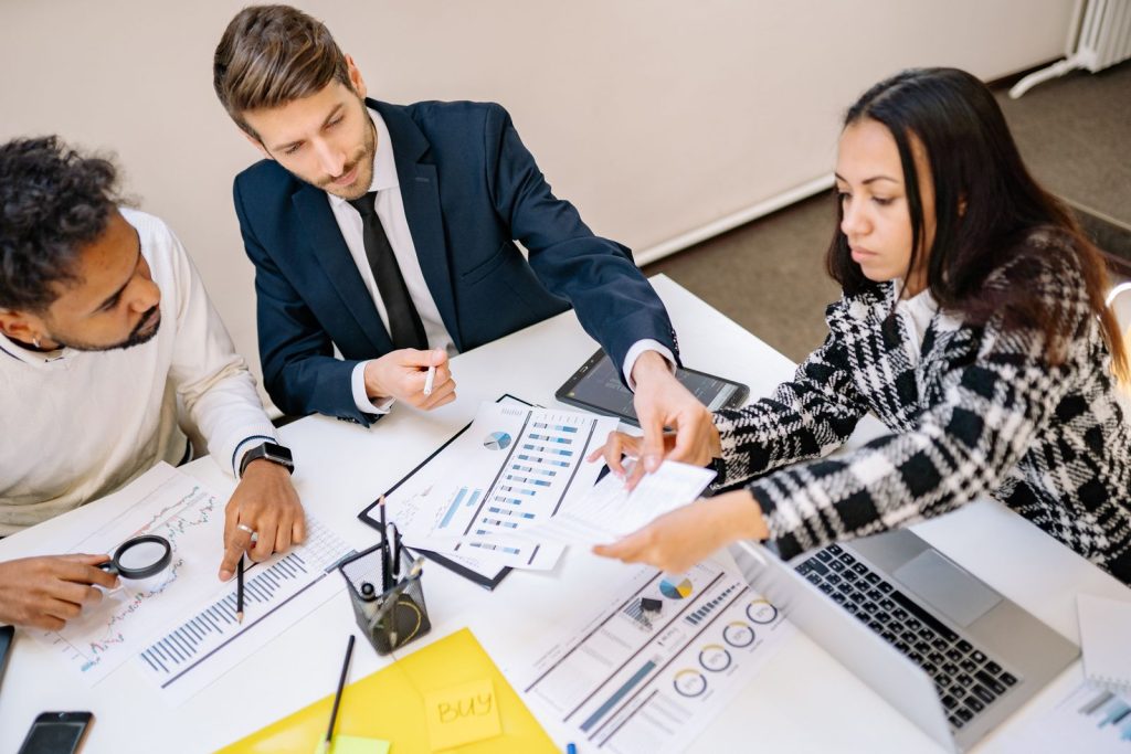Team reviewing documents together around a table