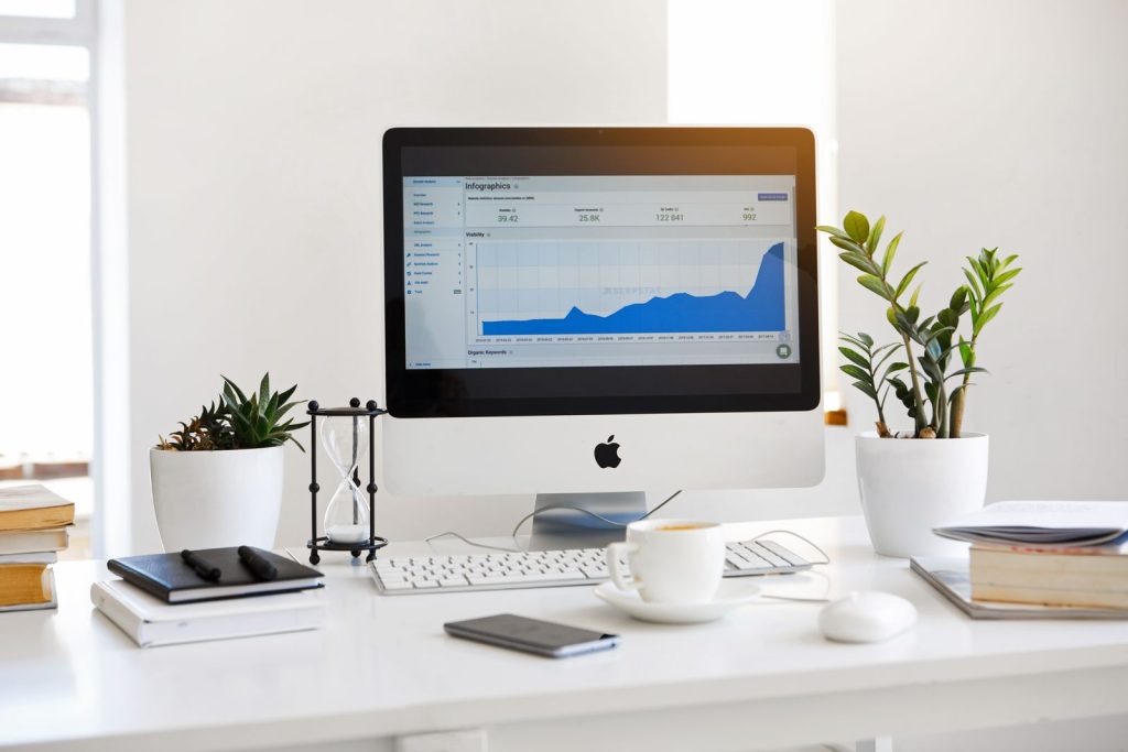 Desktop computer showing a website traffic graph