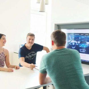 Lillian Group Group Around Table With Tv Screen